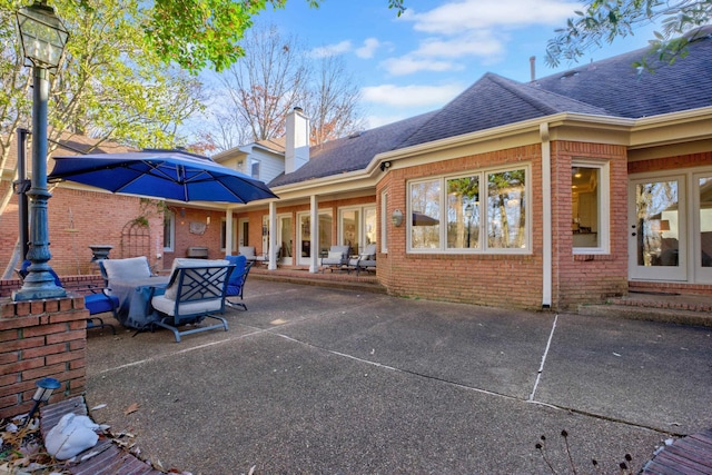 back of property featuring a patio area