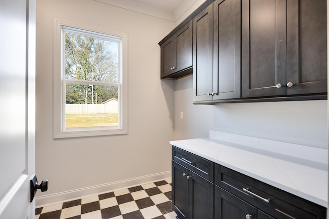 laundry room featuring ornamental molding