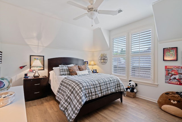 bedroom with ceiling fan and light hardwood / wood-style flooring