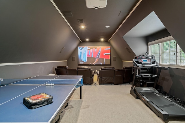 playroom with light carpet and vaulted ceiling