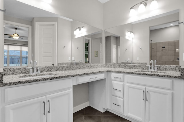 bathroom featuring tile patterned floors, ceiling fan, vanity, and walk in shower