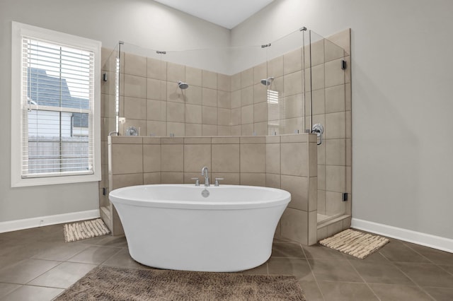 bathroom featuring tile patterned flooring and independent shower and bath