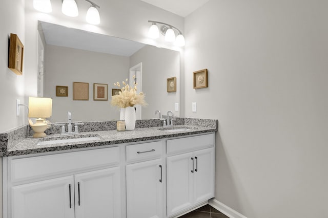 bathroom featuring tile patterned flooring and vanity