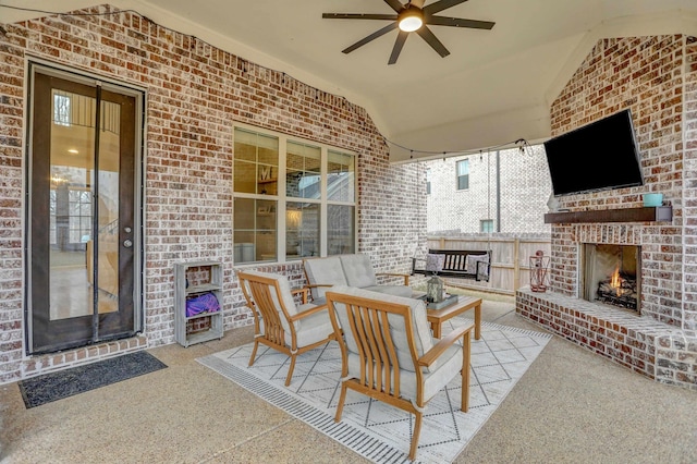 view of patio featuring an outdoor living space with a fireplace and ceiling fan