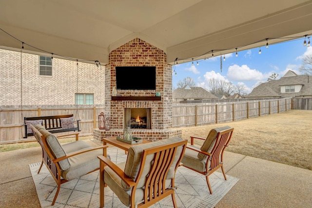 view of patio with an outdoor brick fireplace