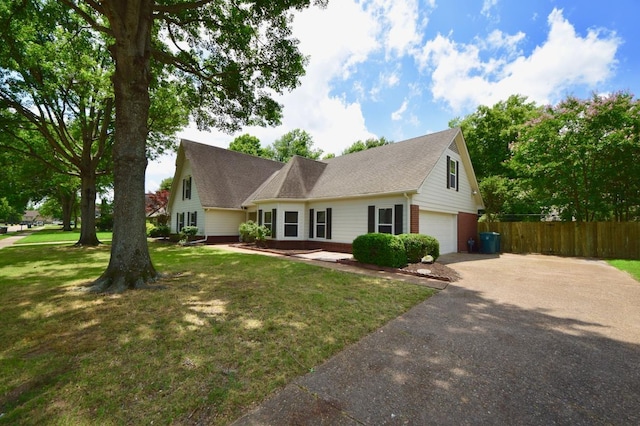 view of front facade with a front yard and a garage