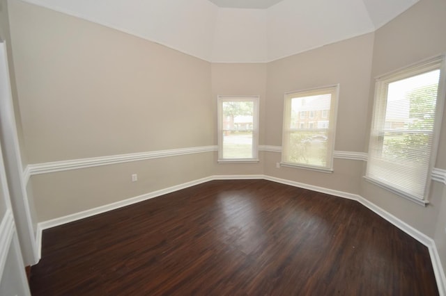 empty room featuring dark hardwood / wood-style flooring