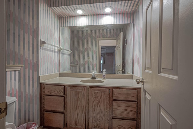 bathroom with vanity and toilet