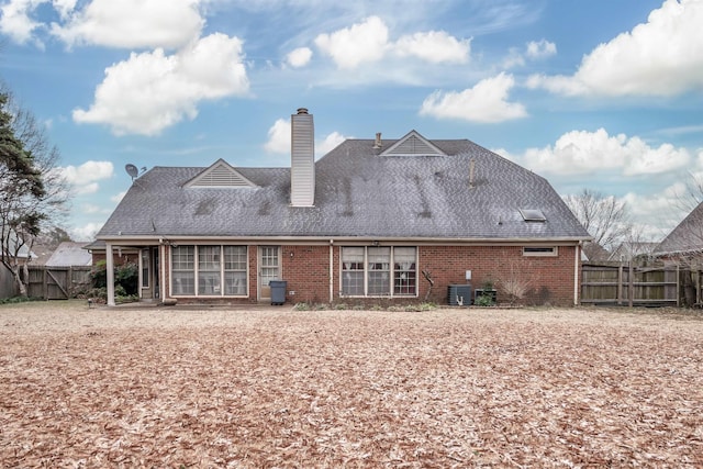 rear view of house with cooling unit