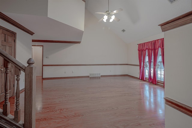 unfurnished living room featuring light hardwood / wood-style floors, high vaulted ceiling, and ceiling fan