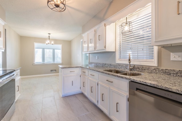 kitchen with white cabinetry, sink, hanging light fixtures, an inviting chandelier, and appliances with stainless steel finishes