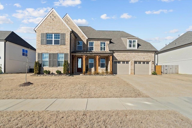 view of front facade featuring a porch and a garage