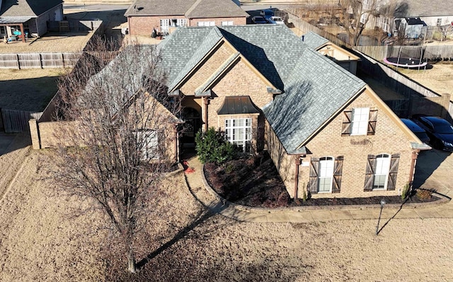 view of front of home with a trampoline