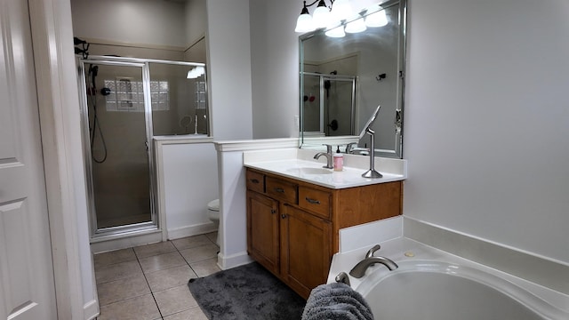 full bathroom featuring vanity, toilet, separate shower and tub, and tile patterned flooring