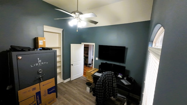 home office with hardwood / wood-style floors and ceiling fan