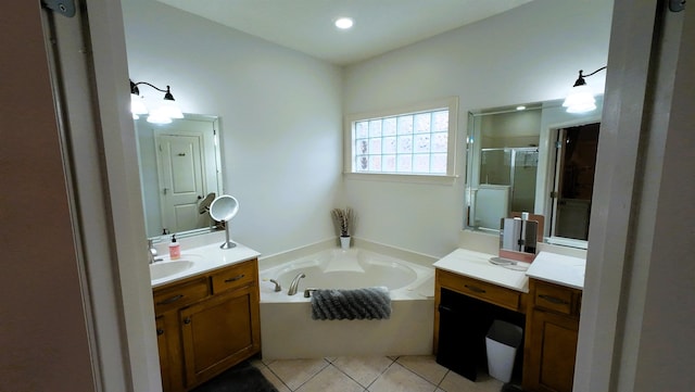 bathroom featuring vanity, tile patterned flooring, and shower with separate bathtub