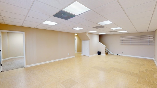 basement featuring a drop ceiling