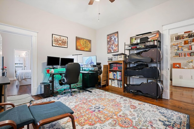 office area with ceiling fan and wood-type flooring