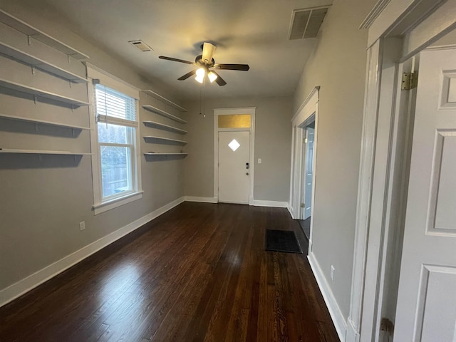 entrance foyer featuring baseboards, visible vents, and hardwood / wood-style floors