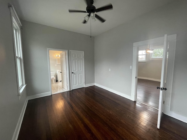 unfurnished bedroom featuring hardwood / wood-style floors and baseboards