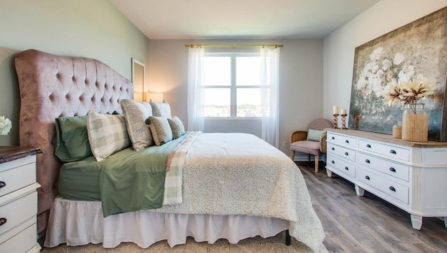 bedroom with wood finished floors