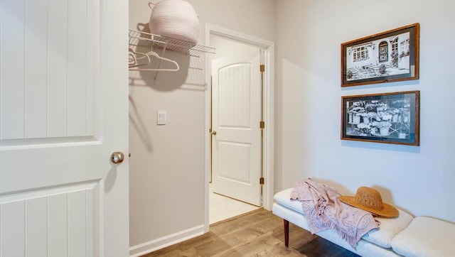 living area with wood finished floors and baseboards