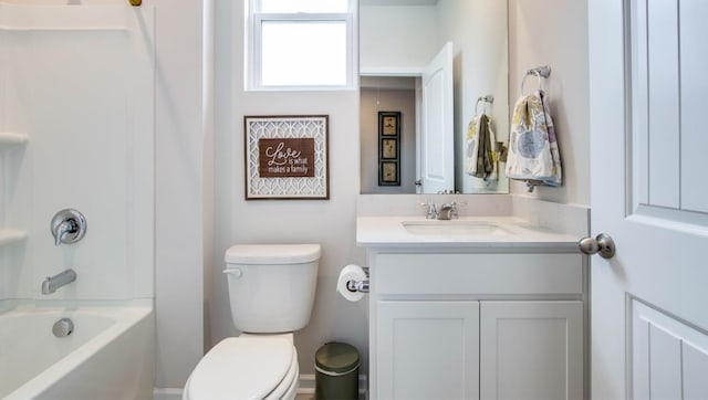 bathroom with toilet, shower / washtub combination, and vanity