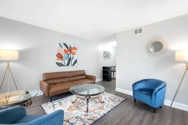 living room with dark hardwood / wood-style flooring