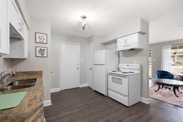 kitchen with white cabinetry, white appliances, dark wood-type flooring, and dark stone counters