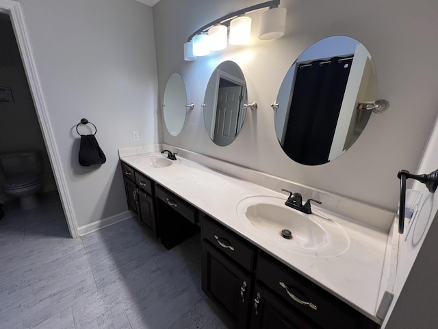 bathroom with vanity and toilet