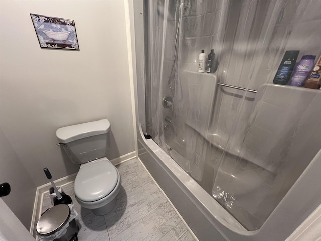 bathroom with shower / bath combo with shower curtain and toilet