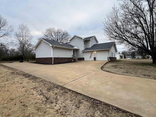 view of side of property with a garage