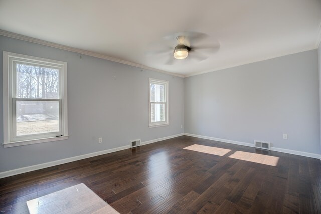 unfurnished room with ceiling fan, dark hardwood / wood-style flooring, and crown molding