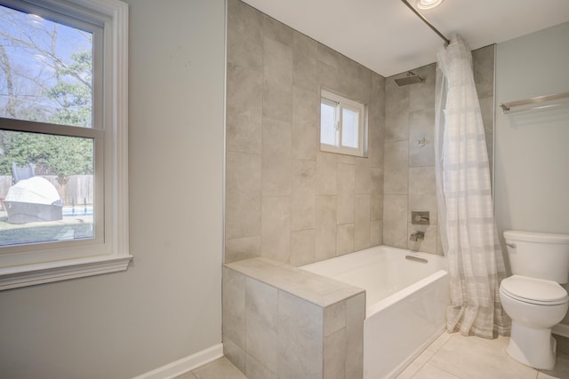 bathroom featuring tile patterned flooring, toilet, and shower / tub combo