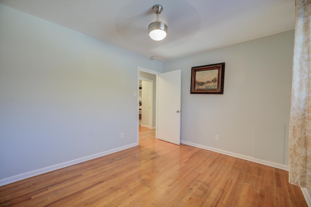 spare room featuring light hardwood / wood-style flooring