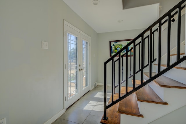 tiled entryway with french doors