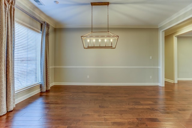 unfurnished room featuring dark hardwood / wood-style floors, crown molding, and a healthy amount of sunlight