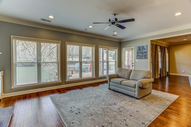 living room with ceiling fan, dark hardwood / wood-style flooring, and crown molding