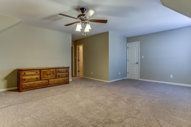 interior space with ceiling fan and light carpet