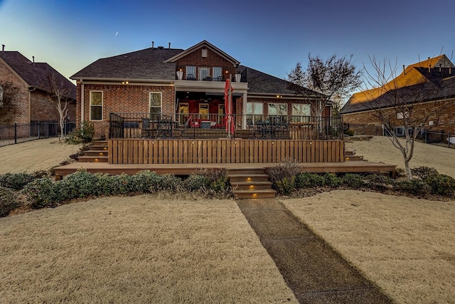 back of property featuring a deck