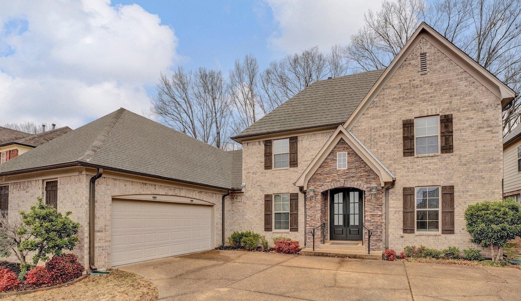 view of front facade featuring french doors and a garage