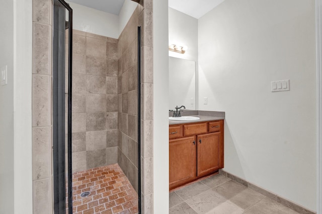 bathroom with vanity and a shower with shower door