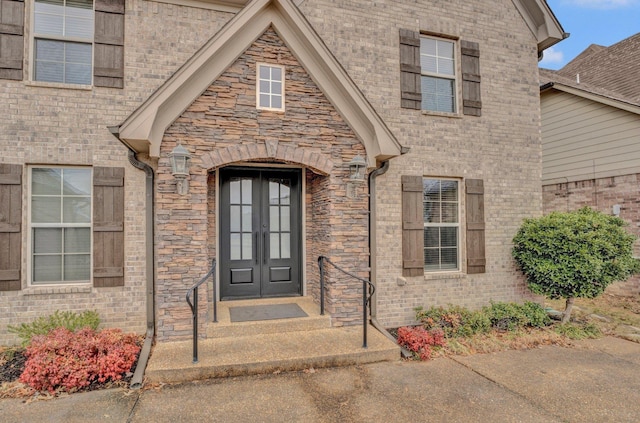 view of exterior entry featuring french doors