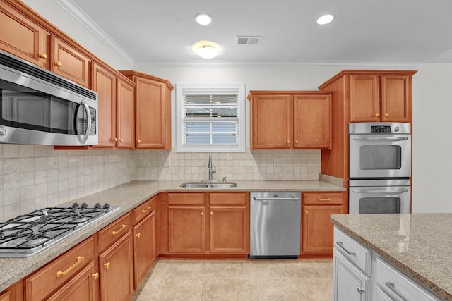 kitchen featuring decorative backsplash, sink, crown molding, and appliances with stainless steel finishes