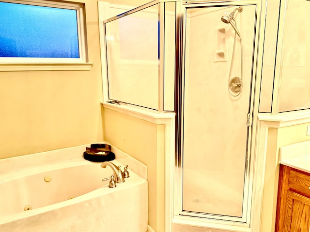 bathroom featuring separate shower and tub