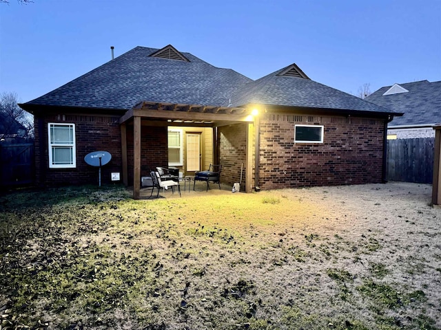 rear view of property featuring a patio area