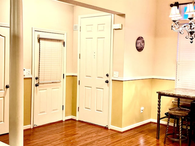 entryway with hardwood / wood-style flooring