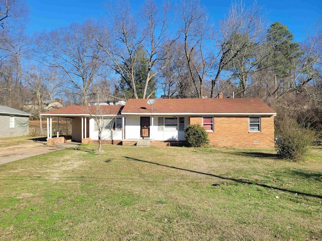 view of front facade featuring a front lawn and a carport