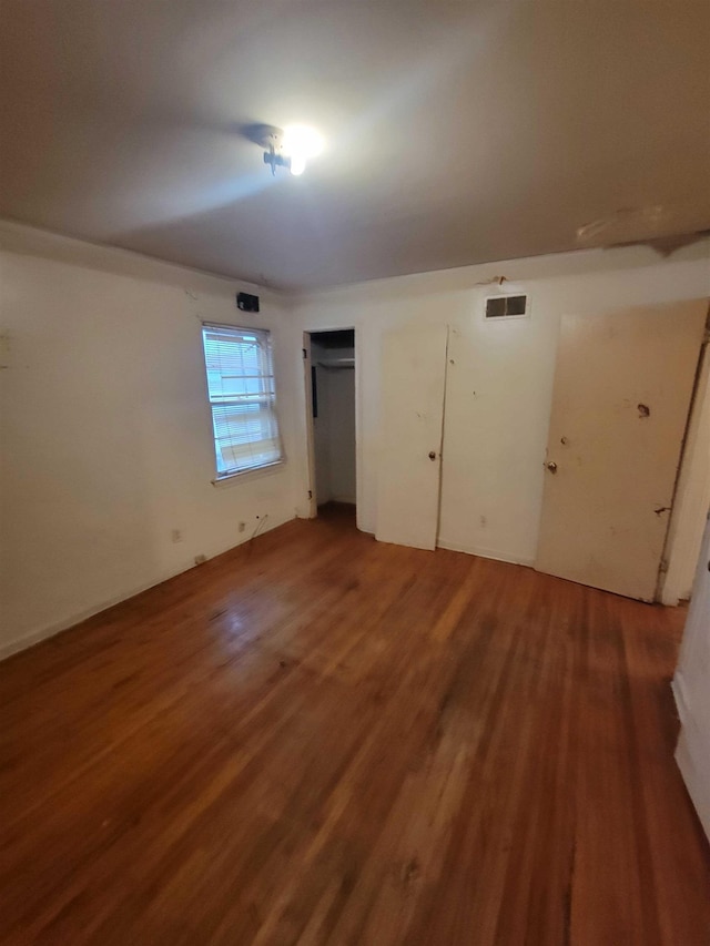 unfurnished bedroom featuring hardwood / wood-style floors