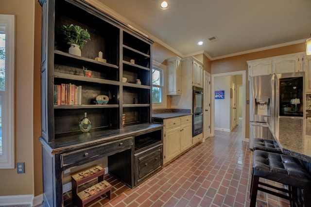 kitchen with white cabinets, stainless steel refrigerator with ice dispenser, crown molding, and double oven